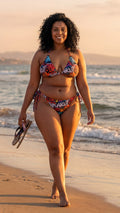 Indakut Everywhere string bikini top with graffiti print worn on beach at sunset
